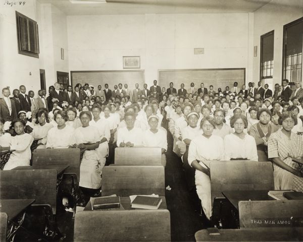African-American students gathered in a room at what the original caption identifies as the "Muskogee Colored High School."