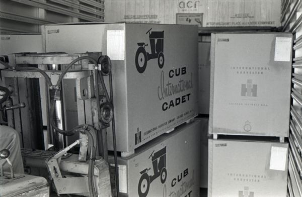 A forklift moves boxes of International Cub Cadet lawn tractors on wooden pallets at the Louisville Works factory.