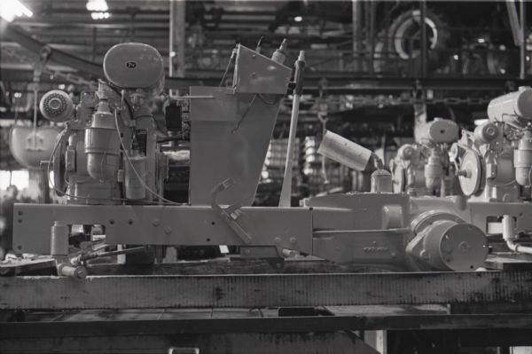 Side view of a Cub Cadet lawn tractor body on a factory assembly line at International Harvester's Louisville Works.