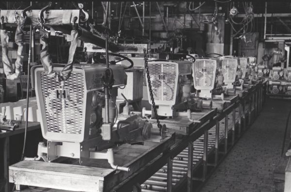 Cub Cadet bodies lined up on a factory assembly line inside International Harvester's Louisville Works.