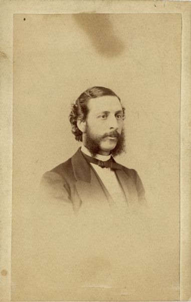 Vignetted carte-de-visite quarter-length portrait of John E. Chapman.