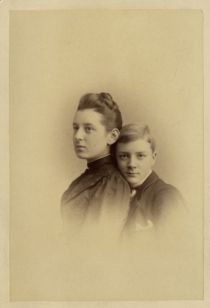 Vignetted carte-de-visite portrait of John and Anna Adams Chapman. John is behind Anna with his head resting on the back of her neck.
