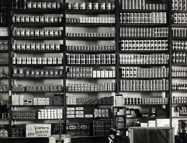 Canned goods are arranged on shelving behind the counter at Lazenby's Mercantile Store.