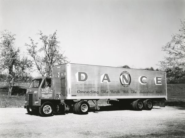 Side view of an International DCO-405 highway truck manufactured by International Harvester and owned by Dance Freight Lines.