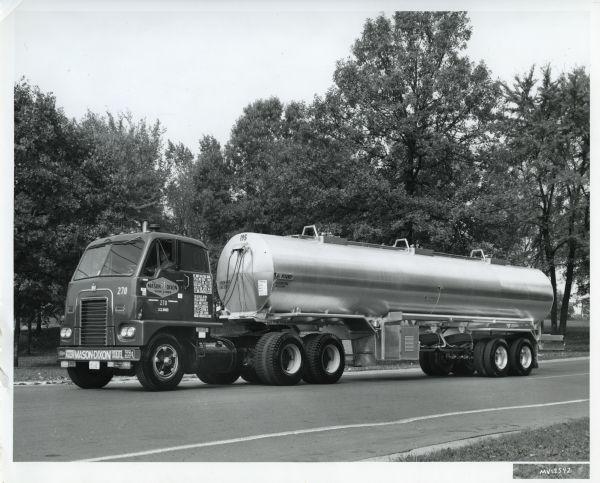 Side view of an International DCOF-405 semi-truck owned by Mason Dixon Tank Lines, Inc.