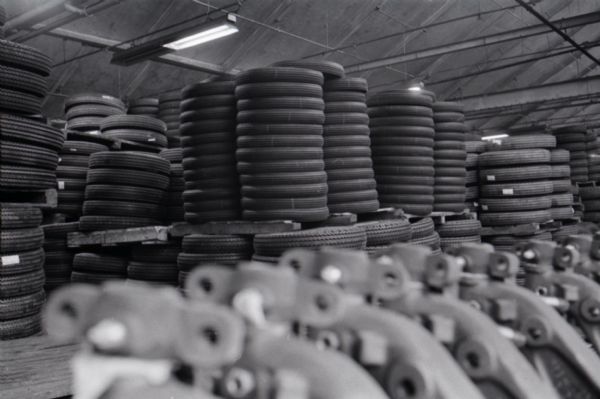Tires and automobile parts are stacked at an International Harvester subsidiary, the Metropolitan Body Company.