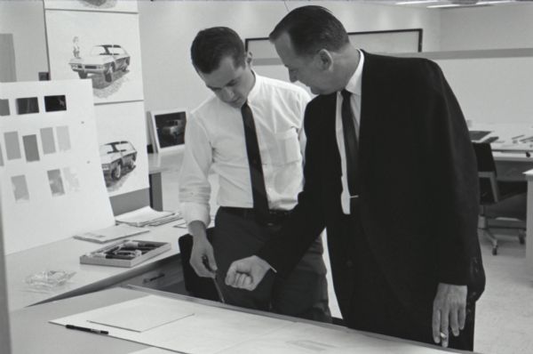 IH engineer Ted Ornas consults with a student at International Harvester's first styling seminar at the Fort Wayne motor truck engineering department. The program lasted ten weeks and participants were college students in their junior year, presented with the challenge of designing a "Multipurpose Safety Utility Vehicle."