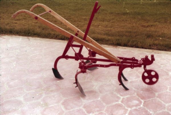 Color photograph of a horse-drawn walking cultivator made at Saltillo Works, an International Harvester factory in Mexico.