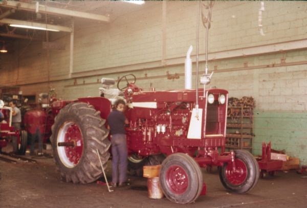 A factory worker on a tractor assembly line at International Harvester's Saltillo Works in Mexico.