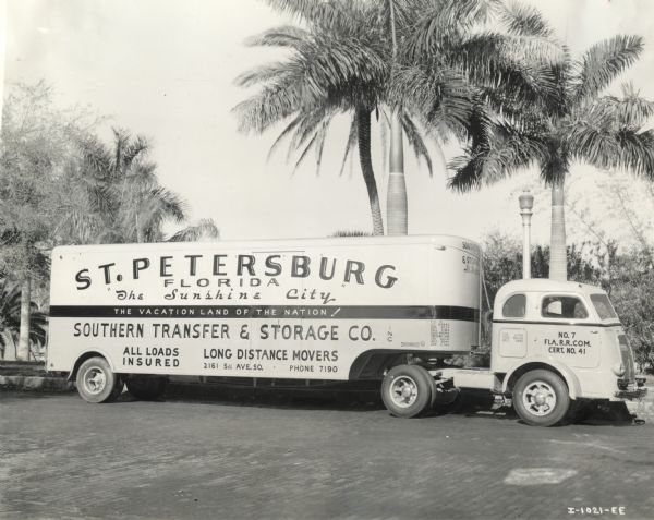 International KS-7-COE tractor-trailer (semi-truck) owned and operated by Southern Transfer & Storage Co. of St. Petersburg, Florida. Palm trees are in the background.