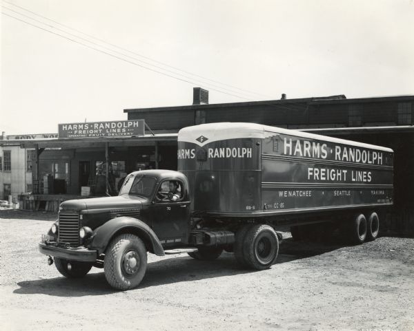 International KR-11 truck operated by Harms-Randolph Freight Lines at a fleet loading station. Original caption reads: "One of three KR-11 International trucks recently added to the transport fleet of Harms and Randolph, Seattle, Washington..."