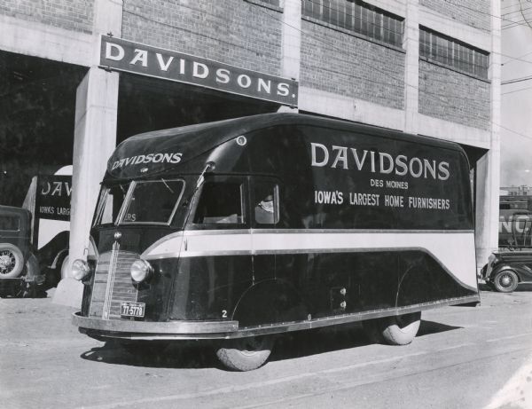 An International D-300 van owned by the Davidsons Company parked outside the store.