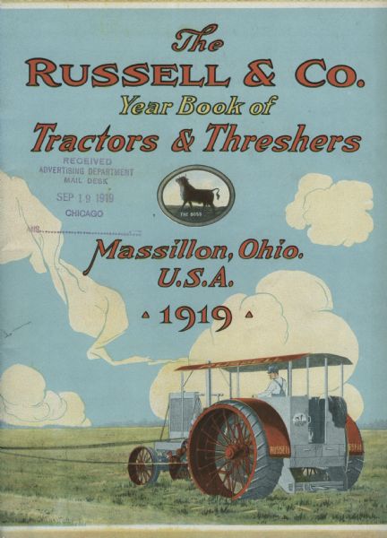 Front cover of an advertising booklet produced by Russell & Co. featuring a color illustration of a man using a Russell tractor to work in a farm field. The text on the cover reads: "The Russell & Co. Year Book of Tractors & Threshers. Massillon, Ohio. U.S.A. 1919."