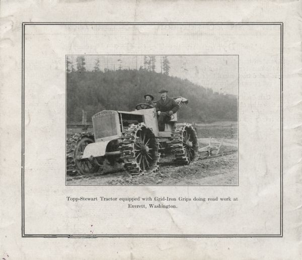 Back cover of a booklet produced by the Grid-Iron Grip Company entitled: "The Tractor Traction Problem Solved: Just like a locomotive, It runs on its own." The cover features a photograph of two men behind the wheel of a tractor accompanied by the caption, "Topp-Stewart Tractor equipped with Grid-Iron Grips doing road work at Everett, Washington."