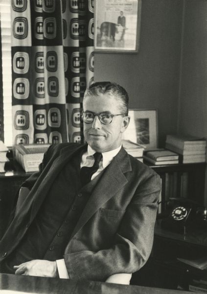 Portrait of William Rice Odell sitting at his desk. A curtain on a window in the background bears the International Harvester Company logo. Odell graduated from Harvard University in 1919. He was elected to the newly-created post of Vice President of Finance in 1959 at International Harvester Company, where he previously served as Vice President and Treasurer. Odell retired in 1962 after more than three decades with the company. He passed away in 1993 in Charlottesville, Virginia.