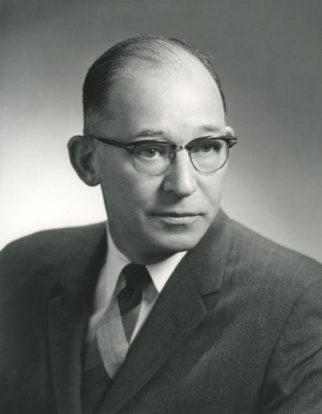 Quarter-length portrait of John W.D. Wright. Wright served International Harvester Company as Comptroller from 1961 to 1963, when he also assumed the role of Vice President.