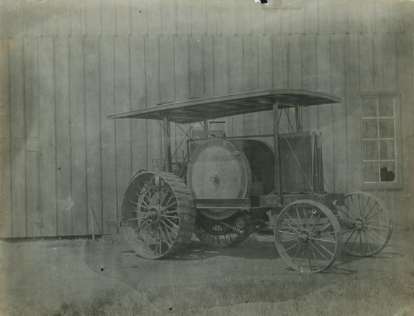 Three-quarter right front side view of a friction-drive tractor by the Ohio Manufacturing Company.