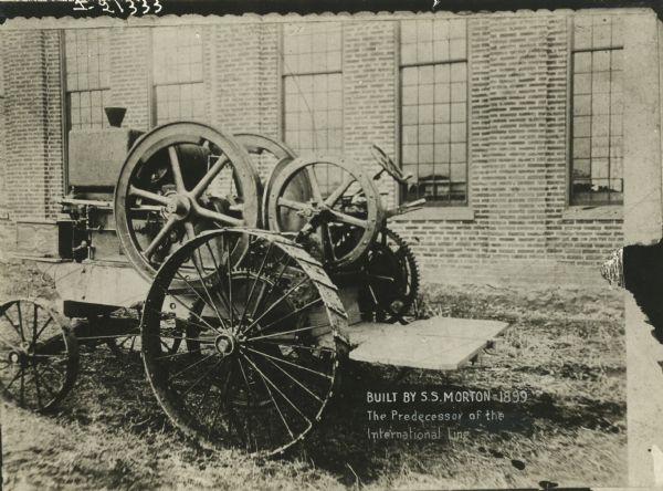 Three-quarter left side view of a tractor built by S.S. Morton. The photograph is labeled, "The Predecessor of the International Line."