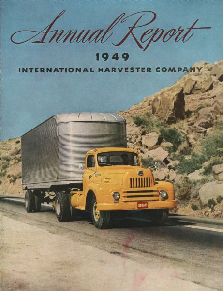 Front cover of International Harvester Company's annual report, featuring a color photograph of a semi-truck driven along a road through rocky terrain.