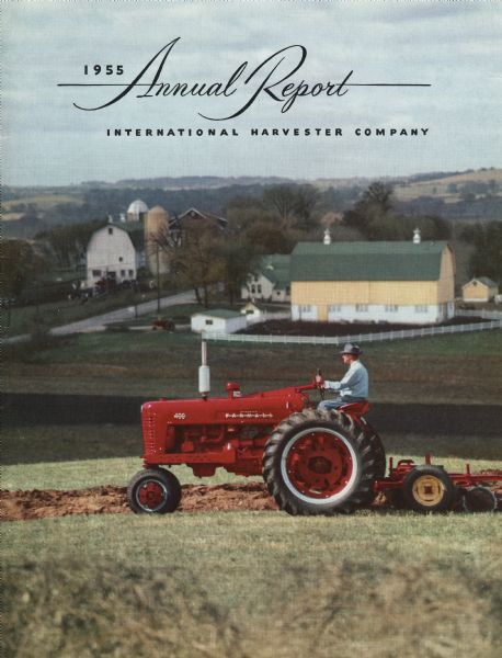 Front cover of the International Harvester Company's annual report, featuring a color photograph of a man operating a Farmall 400 tractor in a field. Farm buildings are in the background.