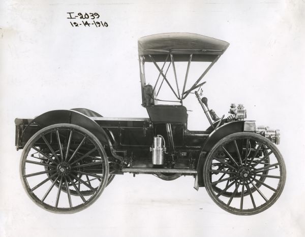 Right side view of an International Auto Wagon with a canopy over the cab, photographed against a white background.