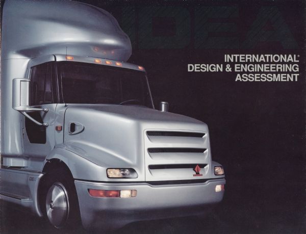 Front cover of a pamphlet advertising the International IDEA truck, featuring a right side view photograph of the truck's cab set against a black background with the word "IDEA" at upper right in dark green letters. IDEA was an acronym for International Design and Engineering Assessment.