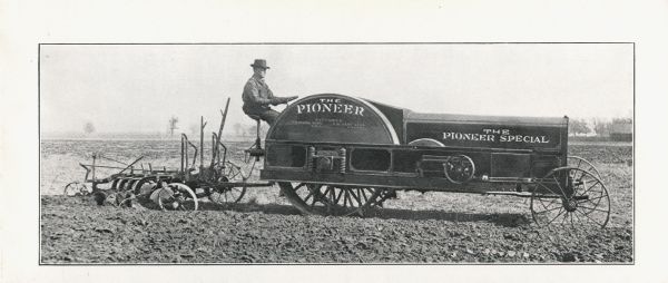 Right side view of a man using a Pioneer Special tractor to plow a field on the outside cover of an advertising pamphlet.