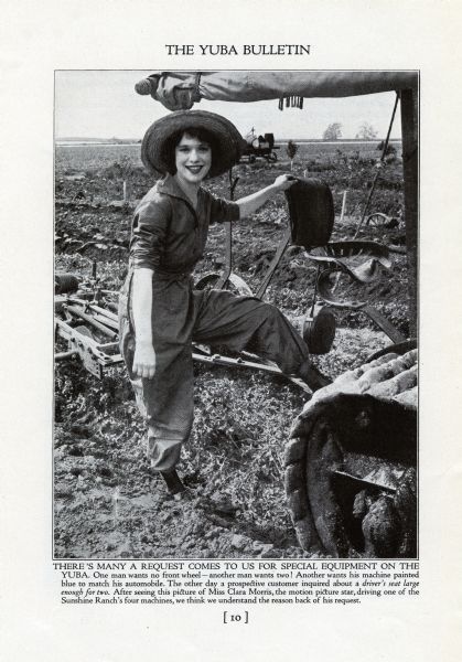 Miss Clara Morris, actress, poses beside a Yuba tractor in a farm field in "The Yuba Bulletin."