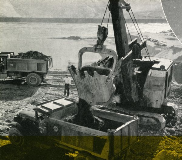 Men using International trucks during the construction of the Grand Coulee Dam.