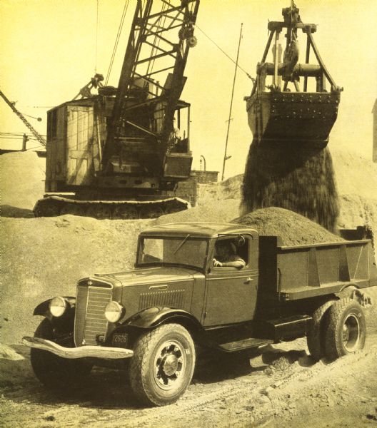 An International C-55 truck works to build a breakwater at Port Allen on the island of Kauai.