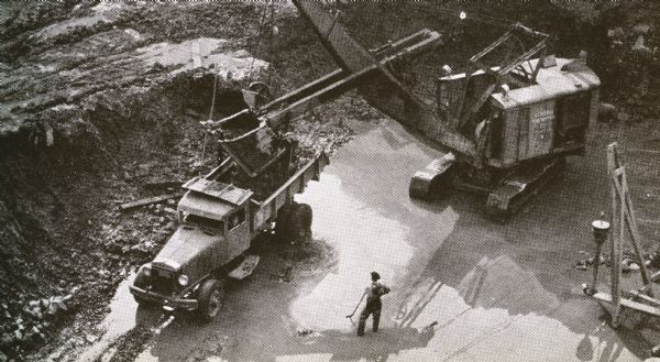 Elevated view of International trucks as they perform heavy-duty jobs while working near the Bonneville Dam.