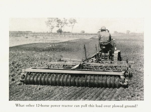 Rear view of a man using a Cletrac crawler tractor and seeder to work in a field. The caption beneath the photograph reads: "What other 12-horse power tractor can pull this load over plowed ground?"