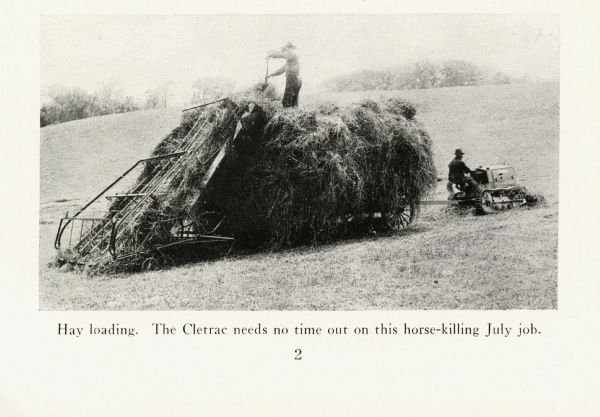 A farmer uses a pitchfork to load hay onto a wagon pulled by a Cletrac crawler tractor. The caption reads: "Hay loading. The Cletrac needs no time out on this horse-killing July job."