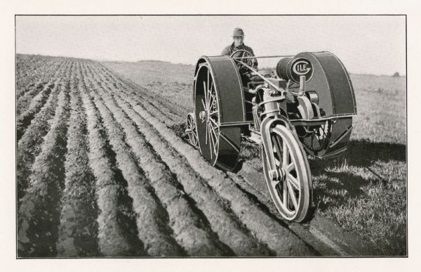 Illustration of a man using the Gile tractor in a farm field.