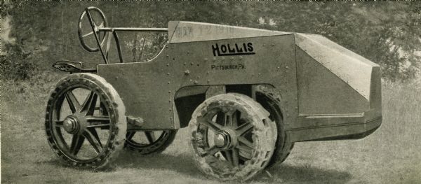 Photograph of a Hollis tractor featured on the exterior panel of an advertising pamphlet. The words: "Pittsburgh, PA" are on the side of the tractor.