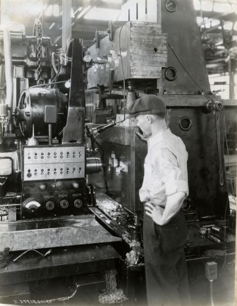Factory worker with machinery at International Harvester's Ft. Wayne Works.