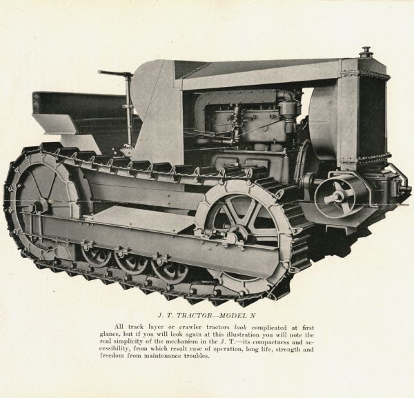 Side-view illustration of a J.T. Model N crawler tractor. The caption beneath the illustration reads: "All track layer or crawler tractors look complicated at first glance, but if you will look again at this illustration you will note the real simplicity of the mechanism in the J.T. — its compactness and accessibility, from which result ease of operation, long life, strength and freedom from maintenance troubles."