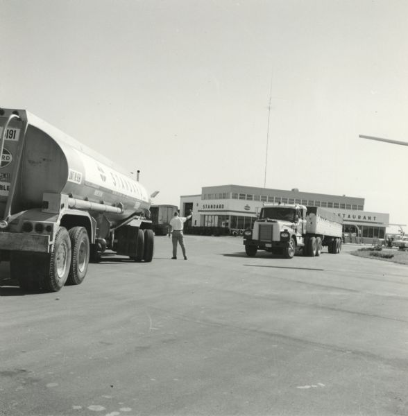 Standard Oil Trucks at an American Oil Company truck stop.