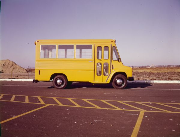 Color photograph of an International M-1200 Metro school bus.