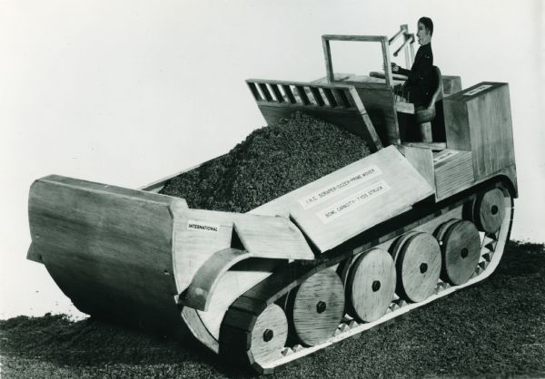 Side view of an International Universal Engineer Tractor mock-up. The original caption reads: "Tactical usage and logistical support features of the Universal Engineer Tractor were apparent in this International Harvester 1956 mock-up."