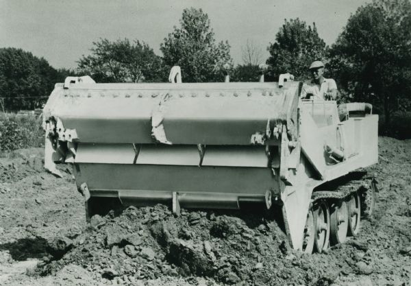 The original caption reads: "With its eight-yard capacity equal to 12 tons, the Universal Engineer Tractor will replace scraper units, self-propelled or crawler tractor drawn."