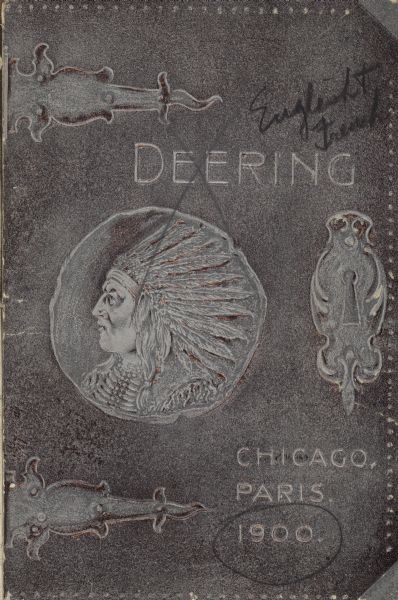 Exhibition catalog cover for Deering exhibits at the United States Agricultural Implement Annex. Text on cover: "Deering. Chicago, Paris." Includes embossed illustrations of a metal binding, a keyhole, and the profile portrait of a Native American wearing a headdress.