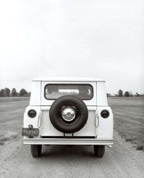 Rear view of an International Scout 46. Featuring Indiana plates, this 1962 International Scout appears to be carrying close to a full load of passengers.