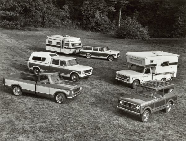 Original caption reads: "Photo#tf-1220. International recreation vehicles for 1975 include Travelall station wagons (top); four-door, six passenger Travelette pickup units (middle left); "Camper Special" pickups (middle right); model 150 series pickups (foreground left); and Scout all-wheel drive modesl (foreground right). TD-3763.  10/1/74."