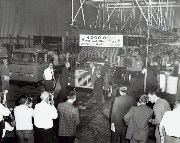 Workers, managers, and officials look on as the 4,000,000th truck produced at Springfield Works is celebrated.