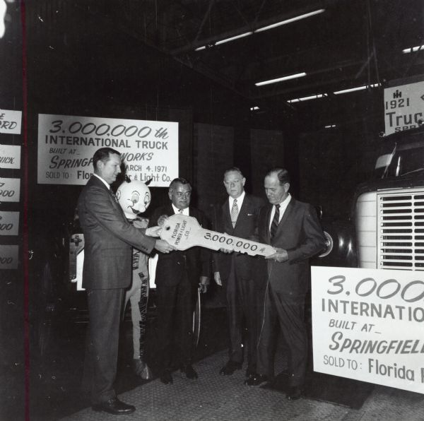 3,000,000th International Truck produced at Springfield works.  Pictured left to right: C.E. Carter, Springfield IH Works Manger; W.E. Wilson, Florida Power and Light Company; Russell C. Burns, Manager IH Retail Truck Sales; J.W. Phillips, Florida Power and Light Miami.