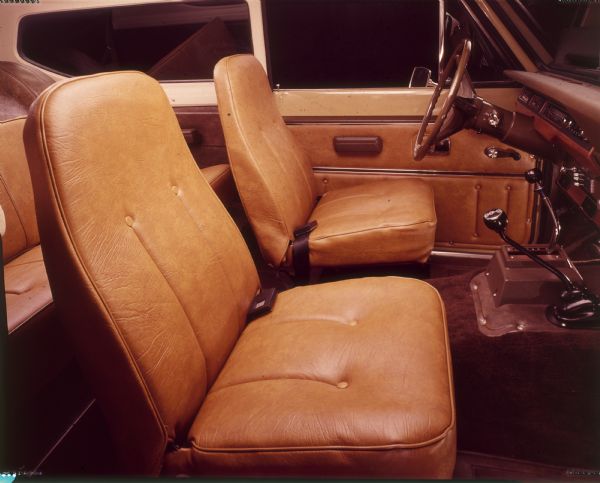 Interior view from passenger side of Scout front seat, and part of back seat.