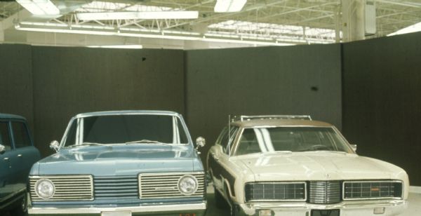 Two Scouts parked next to a Ford? station wagon.