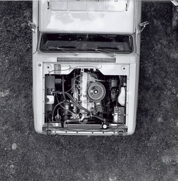 Overhead view of a Scout with the front hood removed, revealing the diesel six cylinder engine created by Chrysler-Nissan. See note below about the IH emblem on the valve cover. 