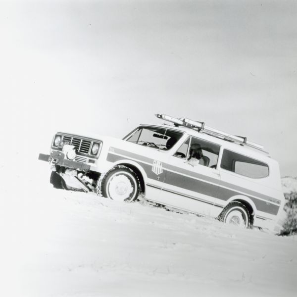 The International Scout Spirit, a celebration of America, tackles the snowy drifts. Sporting the tricolor Red, White, and Blue as well as the emblem of the United States Ski Team this Scout was one of the few selected to represent the United States in service to the U.S. Ski Team.